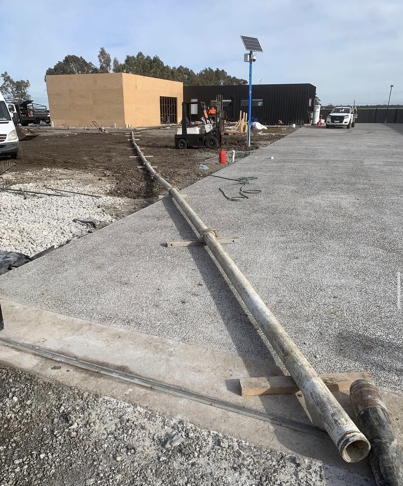 Commercial concrete pumping lines on site